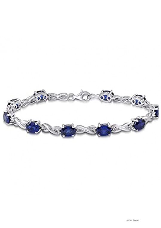 Jewelili Sterling Silver 7x5MM Oval Shape Created Blue Sapphire and Natural White Round Diamond Accent Bracelet  7.25"